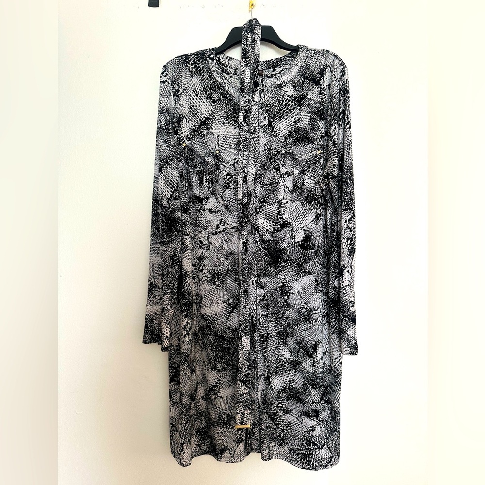 Super trendy snakeskin pattern button down shirt dress. Worn 1x for my birthday